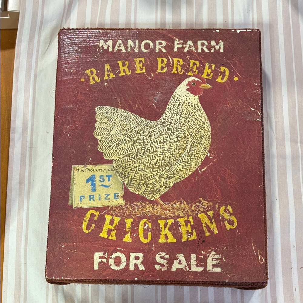 Vintage Farm Sign with Chicken Design Hangs on Wall